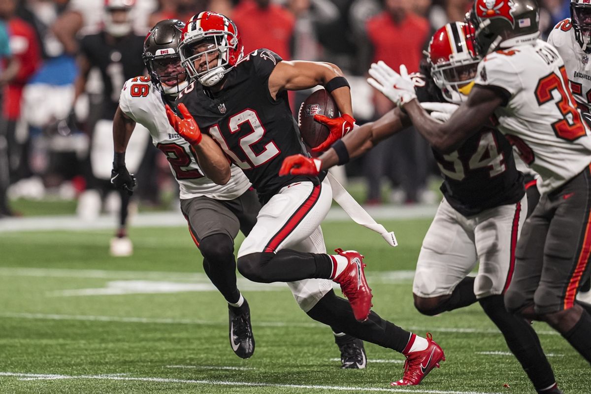 Oct 3, 2024; Atlanta, Georgia, USA; Atlanta Falcons wide receiver KhaDarel Hodge (12) runs for the game winning touchdown against the Tampa Bay Buccaneers in overtime at Mercedes-Benz Stadium. Mandatory Credit: Dale Zanine-Imagn Images
