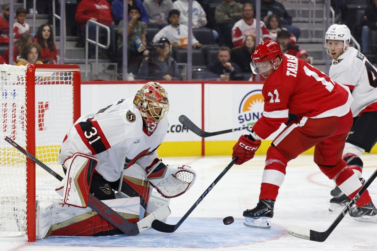 Oct 4, 2024; Detroit, Michigan, USA;  Ottawa Senators goaltender Anton Forsberg (31) makes a save on Detroit Red Wings right wing Vladimir Tarasenko (11) in the second period at Little Caesars Arena. Mandatory Credit: Rick Osentoski-Imagn Images