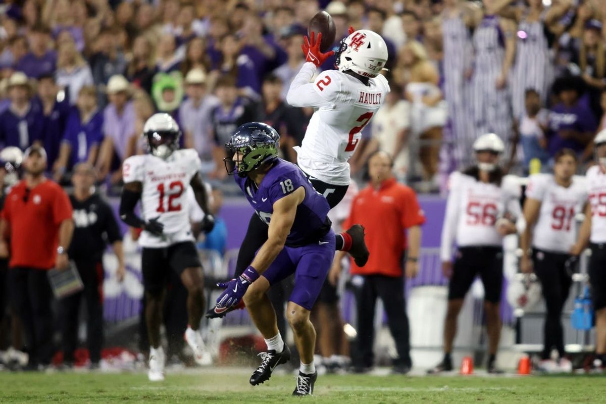 Oct 4, 2024; Fort Worth, Texas, USA; Houston Cougars defensive back A.J. Haulcy (2) intercepts a pass while defending TCU Horned Frogs wide receiver Jack Bech (18) in the second quarter at Amon G. Carter Stadium. Mandatory Credit: Tim Heitman-Imagn Images