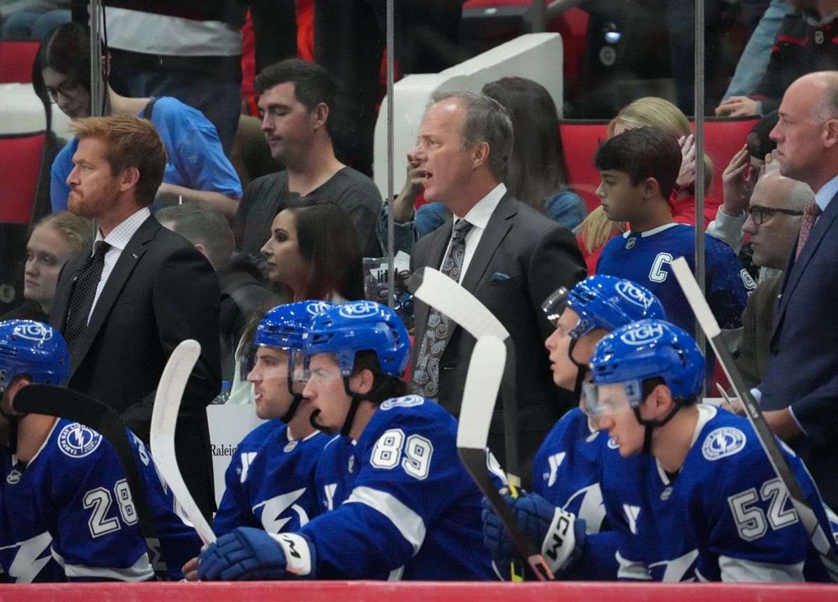 Oct 4, 2024; Raleigh, North Carolina, USA;  Tampa Bay Lightning head coach Jon Cooper looks on against the Carolina Hurricanes during the second period at PNC Arena. Mandatory Credit: James Guillory-Imagn Images