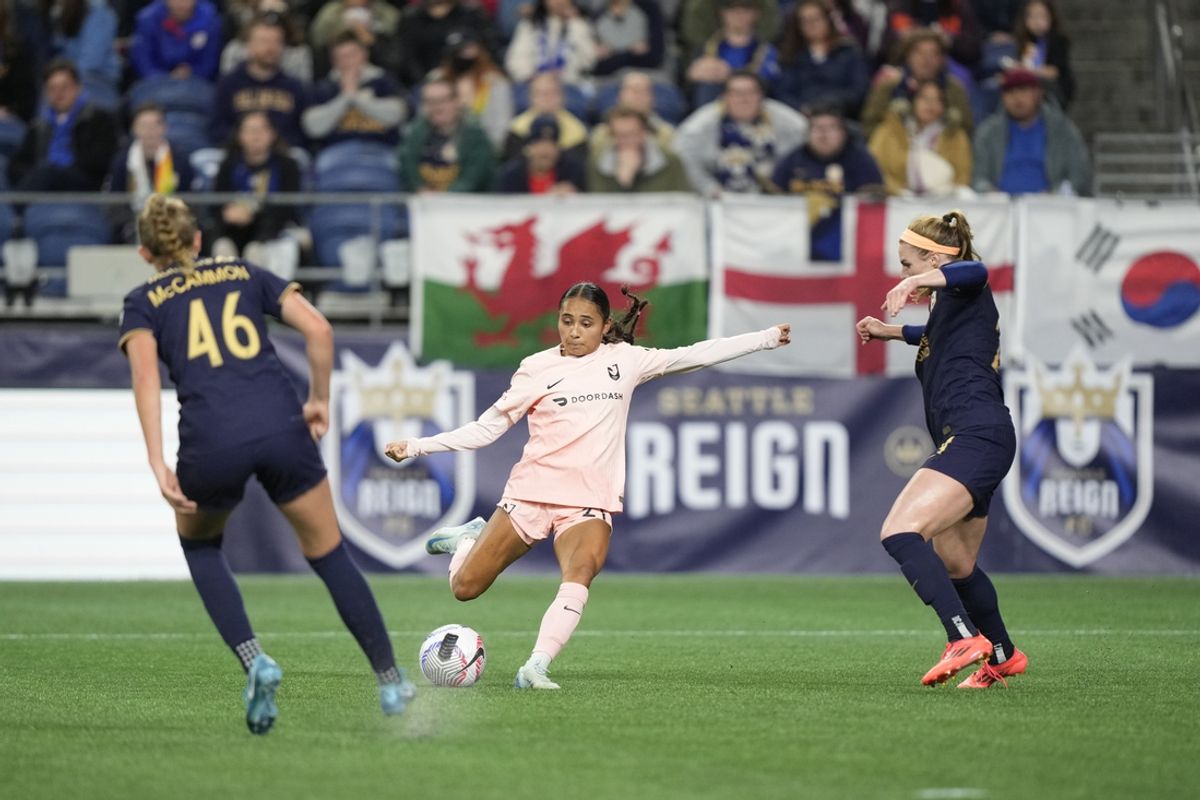 Oct 4, 2024; Seattle, Washington, USA;  Angel City FC midfielder Alyssa Thompson (21) shoots the ball against Seattle Reign FC during the first half at Lumen Field. Mandatory Credit: Stephen Brashear-Imagn Images