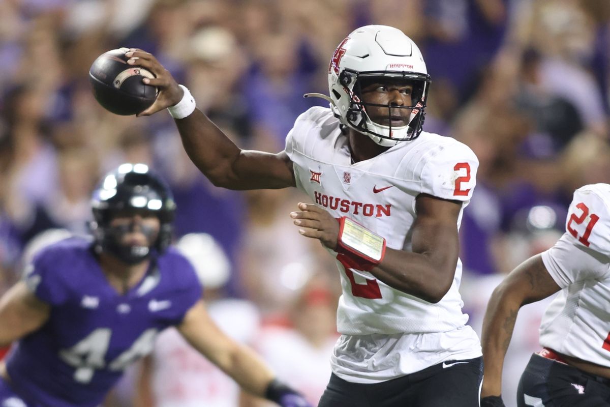 Oct 4, 2024; Fort Worth, Texas, USA; Houston Cougars quarterback Zeon Chriss (2) rolls out to pass in the third quarter against the TCU Horned Frogs at Amon G. Carter Stadium. Mandatory Credit: Tim Heitman-Imagn Images