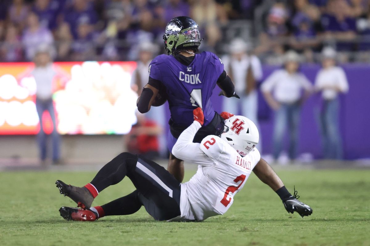 Oct 4, 2024; Fort Worth, Texas, USA; Houston Cougars defensive back A.J. Haulcy (2) tackles TCU Horned Frogs quarterback Hauss Hejny (1) in the third quarter at Amon G. Carter Stadium. Mandatory Credit: Tim Heitman-Imagn Images