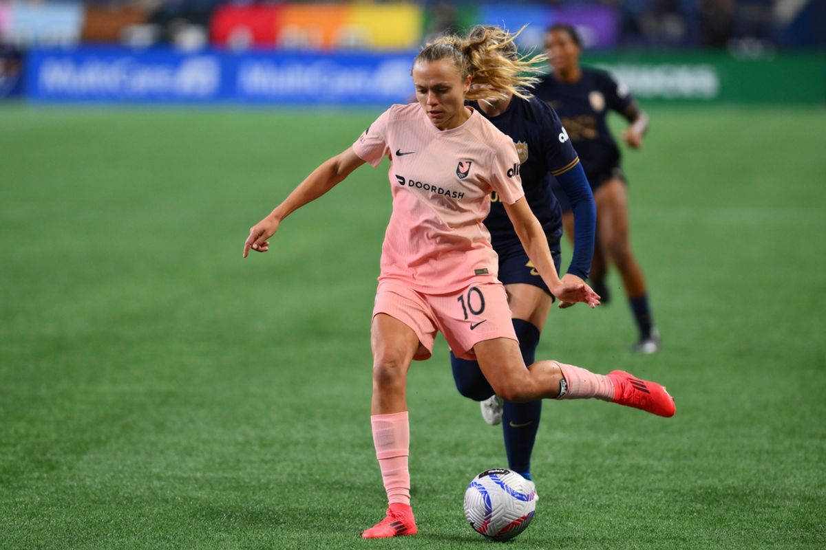Oct 4, 2024; Seattle, Washington, USA;  Angel City FC forward Claire Emslie (10) passes the ball during the second half against Seattle Reign FC at Lumen Field. Mandatory Credit: Steven Bisig-Imagn Images