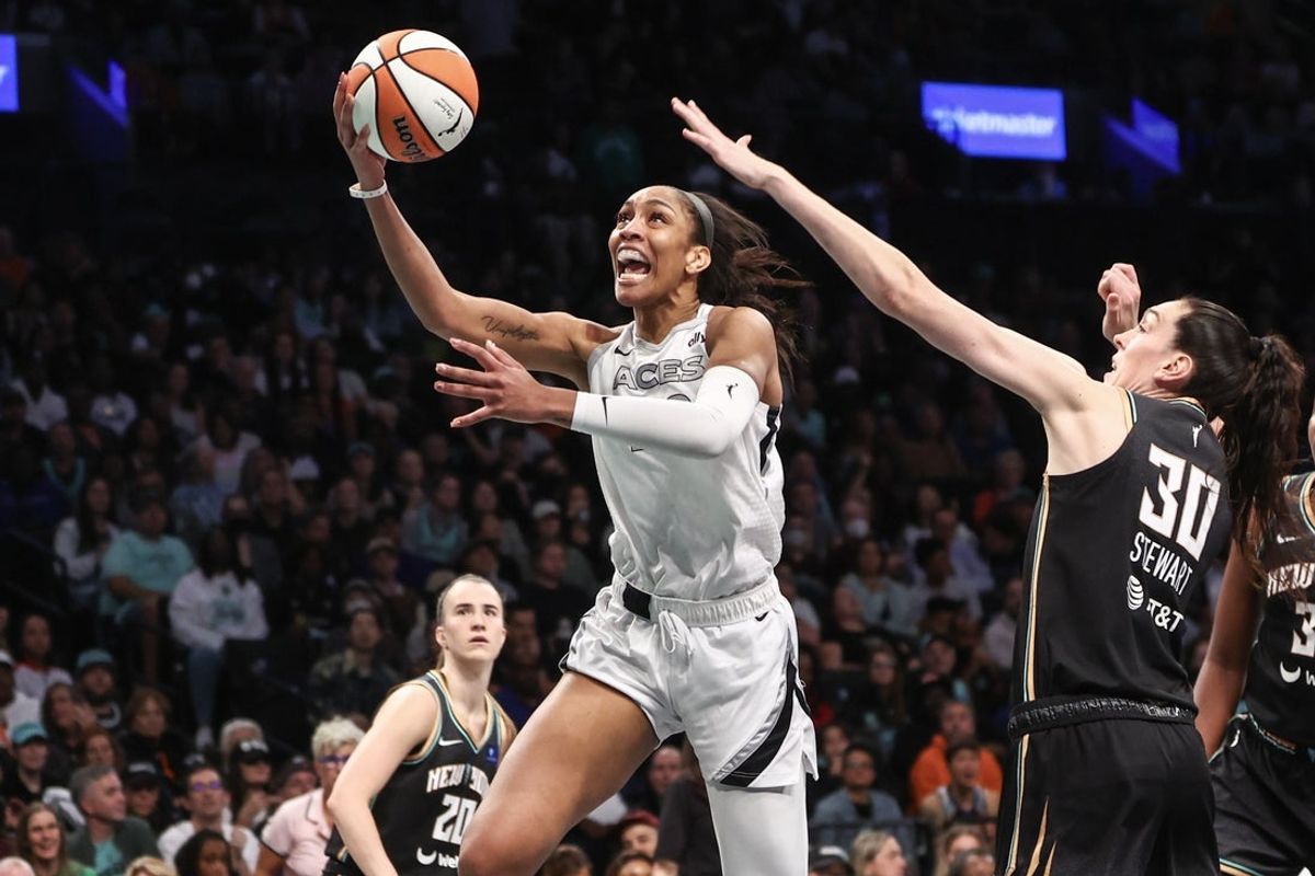 Oct 1, 2024; Brooklyn, New York, USA; Las Vegas Aces center A'ja Wilson (22) and New York Liberty forward Breanna Stewart (30) during game two of the 2024 WNBA Semi-finals at Barclays Center. Mandatory Credit: Wendell Cruz-Imagn Images