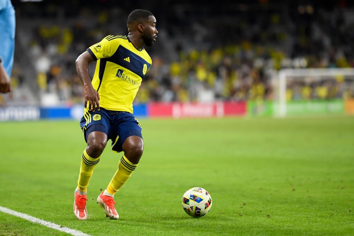Oct 2, 2024; Nashville, Tennessee, USA;  Nashville SC defender Shaq Moore (18) dribbles the ball against the D.C. United during the second half at Geodis Park. Mandatory Credit: Steve Roberts-Imagn Images