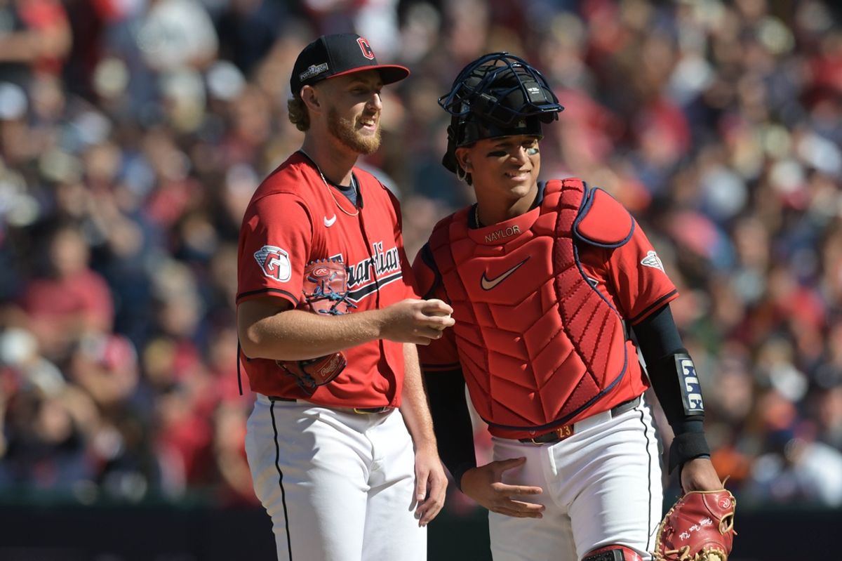 Oct 5, 2024; Cleveland, OH, USA; Cleveland Guardians catcher Bo Naylor (23) and Guardians pitcher Tanner Bibee (28) on the mound in the first inning against the Detroit Tigers in game one of the ALDS for the 2024 MLB Playoffs at Progressive Field. Mandatory Credit: Ken Blaze-Imagn Images