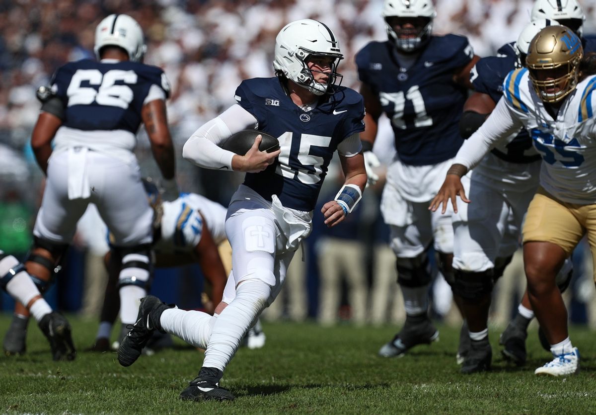 Oct 5, 2024; University Park, Pennsylvania, USA; Penn State Nittany Lions quarterback Drew Allar (15) runs with the ball during the second quarter against the UCLA Bruins at Beaver Stadium. Mandatory Credit: Matthew O'Haren-Imagn Images