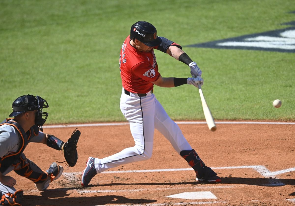 Oct 5, 2024; Cleveland, OH, USA;  Cleveland Guardians outfielder Lane Thomas (8) hits a three-run home run against the Detroit Tigers in the first inning in game one of the ALDS for the 2024 MLB Playoffs at Progressive Field. Mandatory Credit: David Richard-Imagn Images