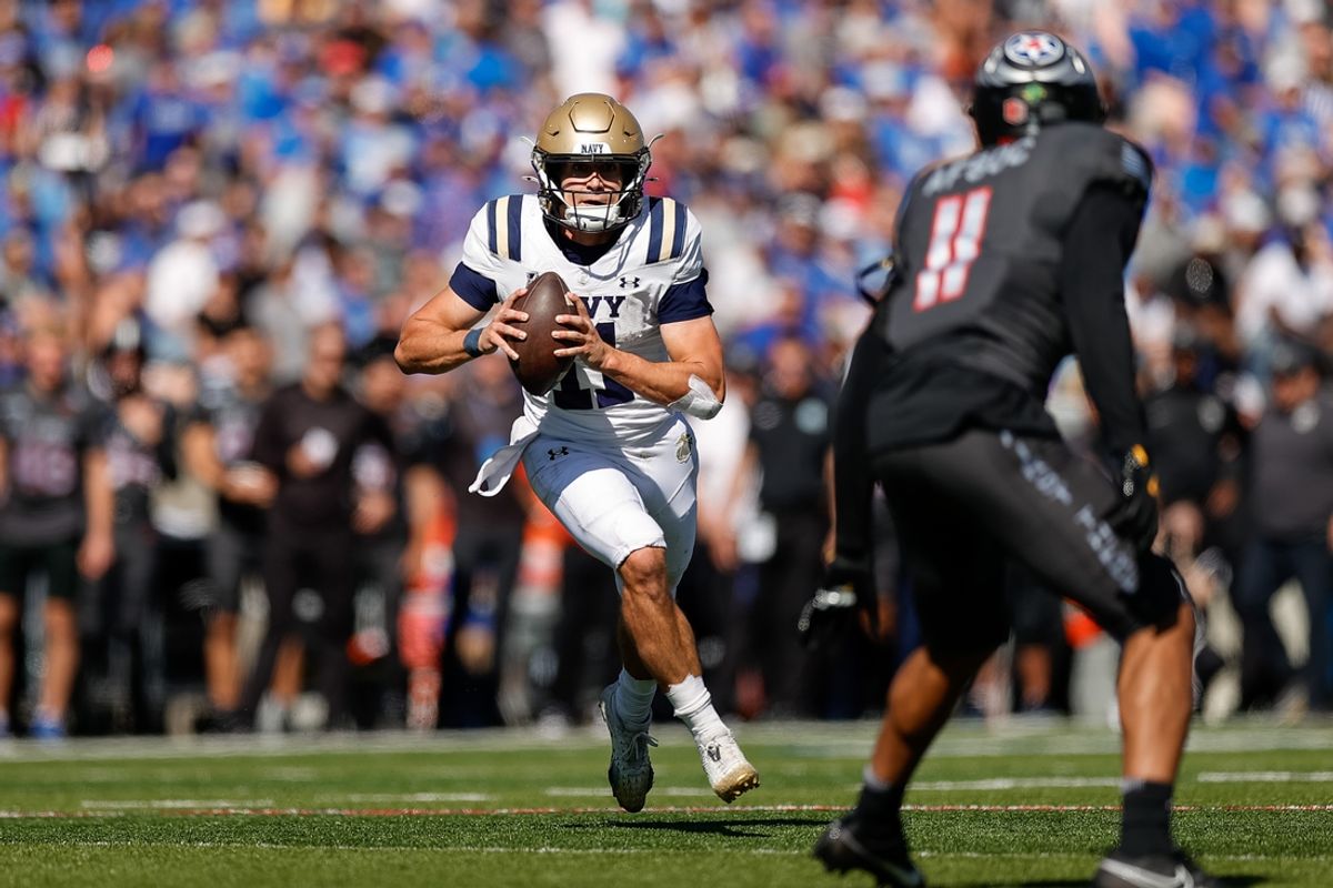 Oct 5, 2024; Colorado Springs, Colorado, USA; Navy Midshipmen quarterback Blake Horvath (11) runs the ball as Air Force Falcons defensive back Camby Goff (11) defends in the second quarter at Falcon Stadium. Mandatory Credit: Isaiah J. Downing-Imagn Images