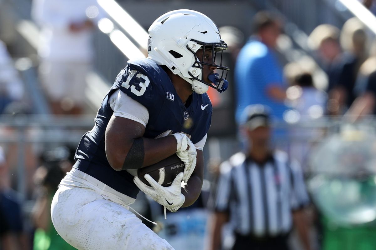 Oct 5, 2024; University Park, Pennsylvania, USA; Penn State Nittany Lions running back Kaytron Allen (13) runs with the ball during the fourth quarter against the UCLA Bruins at Beaver Stadium. Mandatory Credit: Matthew O'Haren-Imagn Images
