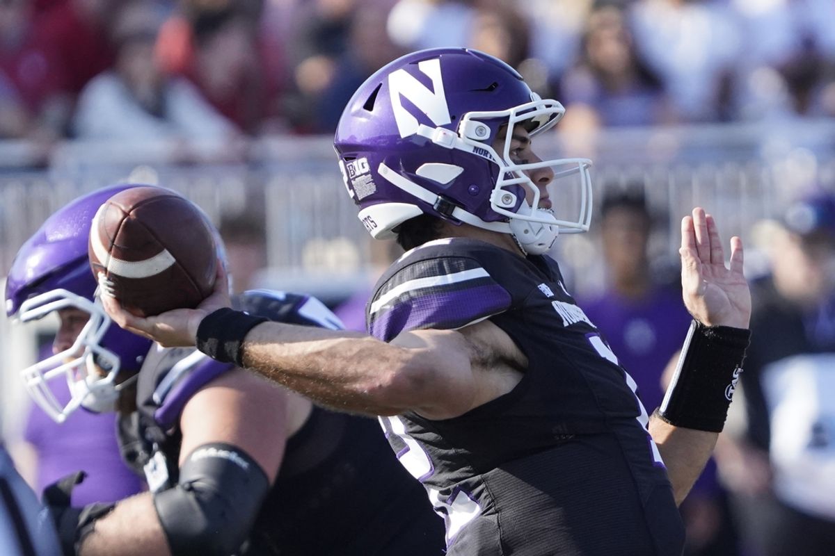 Oct 5, 2024; Evanston, Illinois, USA; Northwestern Wildcats quarterback Jack Lausch (12) passes the ball against the Indiana Hoosiers during the first half at Lanny and Sharon Martin Stadium. Mandatory Credit: David Banks-Imagn Images