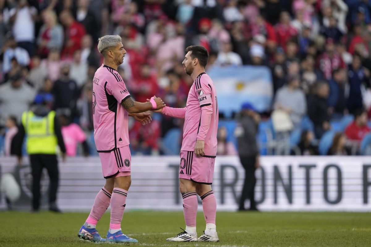 Oct 5, 2024; Toronto, Ontario, CAN; Inter Miami CF forward Luis Suarez (9) and forward Lionel Messi (10) celebrate after the match against the Toronto FC  at BMO Field. Mandatory Credit: Kevin Sousa-Imagn Images