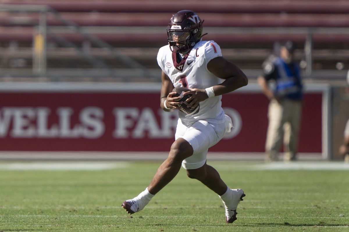 Oct 5, 2024; Stanford, California, USA;  Virginia Tech Hokies quarterback Kyron Drones (1) runs with the football against the Stanford Cardinal during the fourth quarter at Stanford Stadium. Mandatory Credit: Stan Szeto-Imagn Images