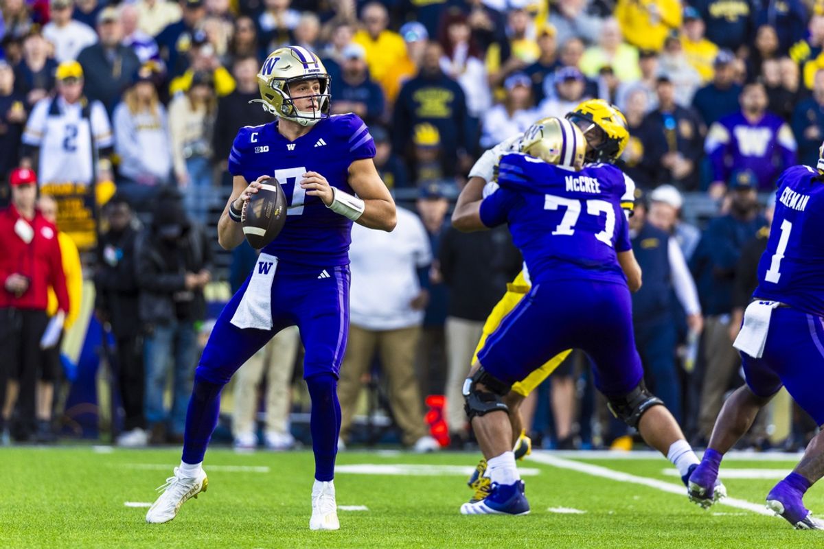 Oct 5, 2024; Seattle, Washington, USA; Washington Huskies quarterback Will Rogers (7) passes against the Michigan Wolverines during the first quarter at Alaska Airlines Field at Husky Stadium. Mandatory Credit: Joe Nicholson-Imagn Images