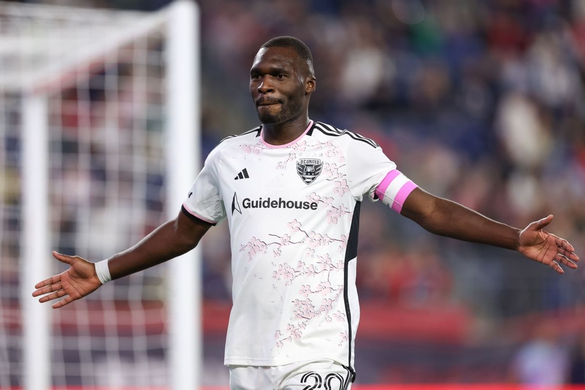 Oct 5, 2024; Foxborough, Massachusetts, USA; D.C. United forward Christian Benteke (20) celebrates after a goal during the first half against the New England Revolution at Gillette Stadium. Mandatory Credit: Paul Rutherford-Imagn Images