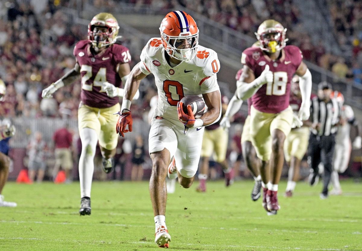 Oct 5, 2024; Tallahassee, Florida, USA; Clemson Tigers wide receiver Antonio Williams (0) scores a touchdown against the Florida State Seminoles during the first half at Doak S. Campbell Stadium. Mandatory Credit: Melina Myers-Imagn Images