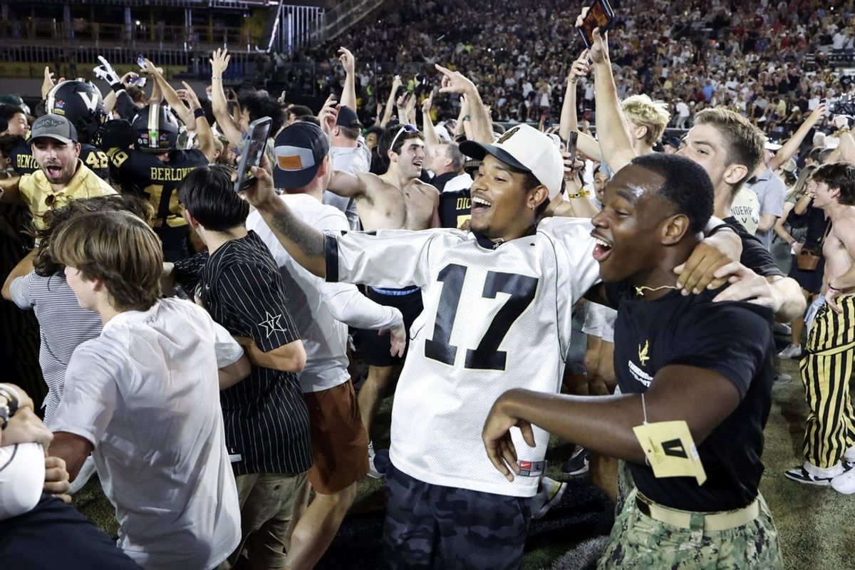 Oct 5, 2024; Nashville, Tennessee, USA;  Vanderbilt Commodores fans storm the field after upsetting the Alabama Crimson Tide at FirstBank Stadium. Mandatory Credit: Butch Dill-Imagn Images