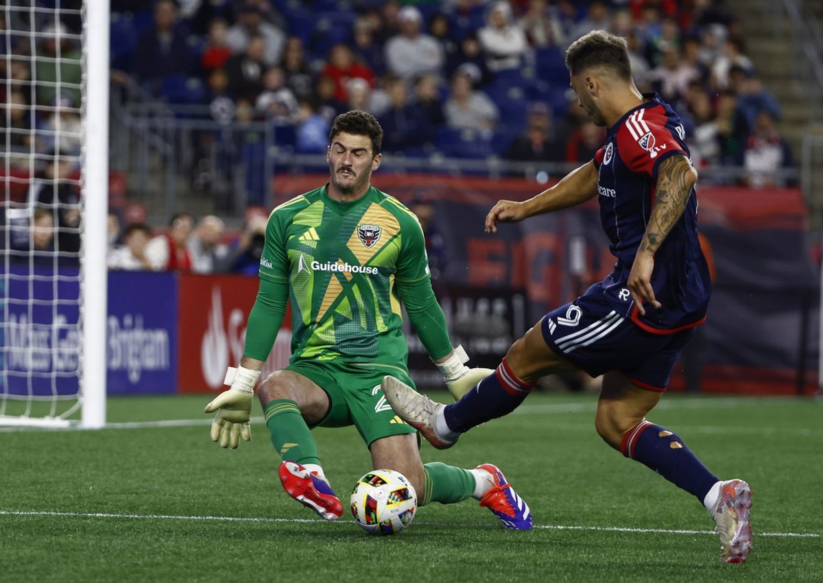 Oct 5, 2024; Foxborough, Massachusetts, USA; New England Revolution forward Giacomo Vrioni (9) takes a shot on goal against D.C. United goalkeeper Alex Bono (24) during the first half at Gillette Stadium. Mandatory Credit: Winslow Townson-Imagn Images