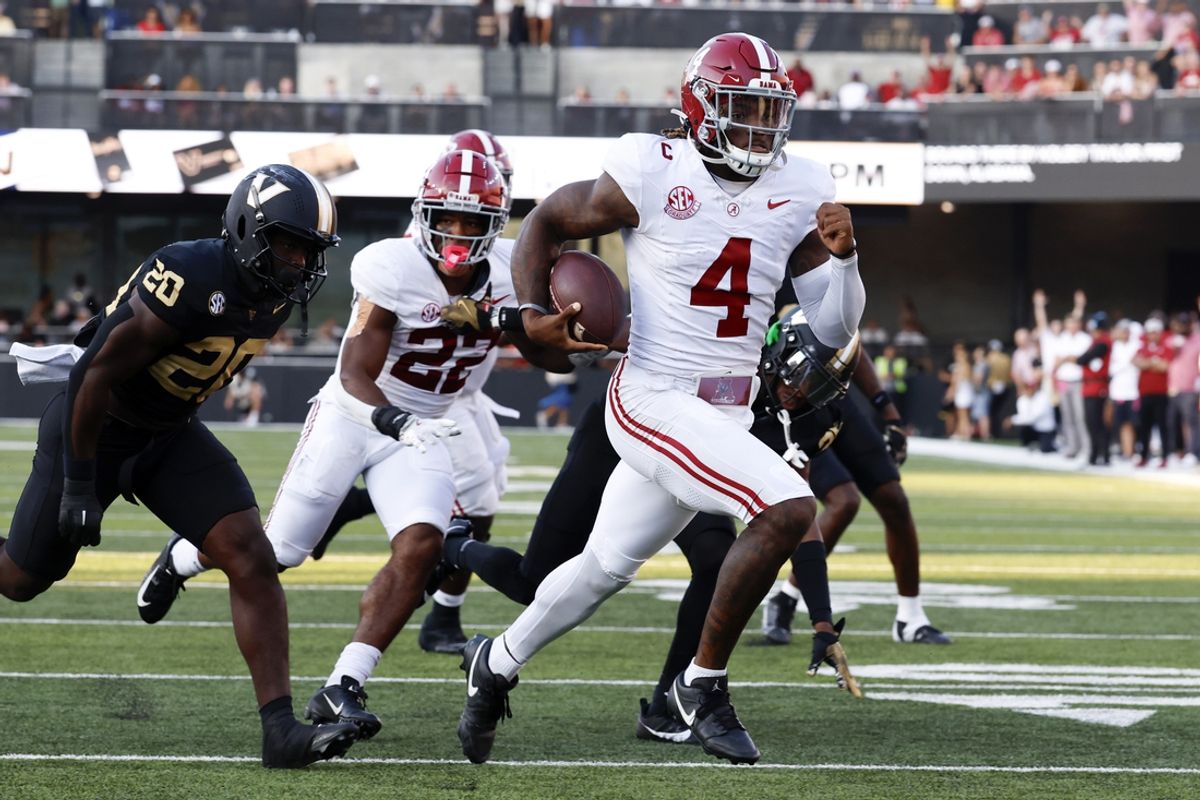 Oct 5, 2024; Nashville, Tennessee, USA;  Alabama Crimson Tide quarterback Jalen Milroe (4) carries the ball in for a touchdown against the Vanderbilt Commodores during the second half at FirstBank Stadium. Mandatory Credit: Butch Dill-Imagn Images