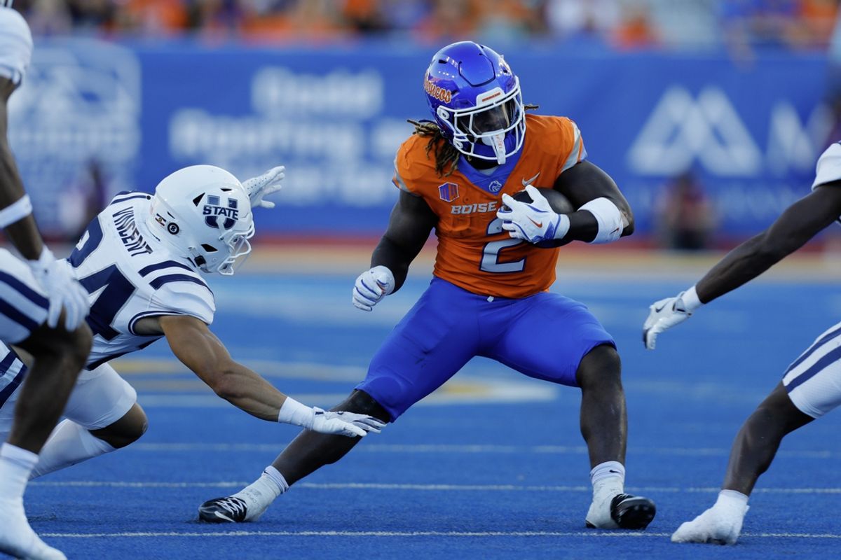 Oct 5, 2024; Boise, Idaho, USA; Boise State Broncos running back Ashton Jeanty (2) runs for gain during the first half against the Utah State Aggies at Albertsons Stadium. Mandatory Credit: Brian Losness-Imagn Images