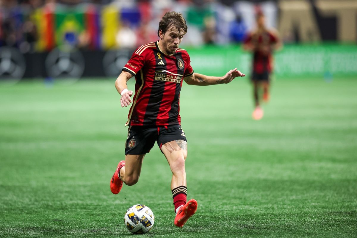 Oct 5, 2024; Atlanta, Georgia, USA; Atlanta United midfielder Saba Lobjanidze (9) handles the ball against the New York Red Bulls in the first half at Mercedes-Benz Stadium. Mandatory Credit: Brett Davis-Imagn Images