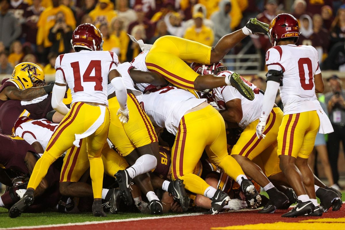 Oct 5, 2024; Minneapolis, Minnesota, USA; Minnesota Golden Gophers quarterback Max Brosmer (16) runs the ball for a touchdown against the USC Trojans during the first half at Huntington Bank Stadium. Mandatory Credit: Matt Krohn-Imagn Images