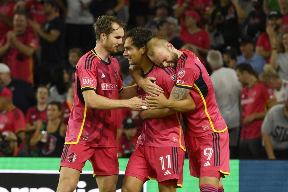 Oct 5, 2024; St. Louis, Missouri, USA; St. Louis CITY SC forward Simon Becher (11) celebrates with defender Henry Kessler (5) and forward Joao Klauss (9) after scoring a goal against Houston Dynamo FC in the second half at CITYPARK. Mandatory Credit: Jeff Le-Imagn Images