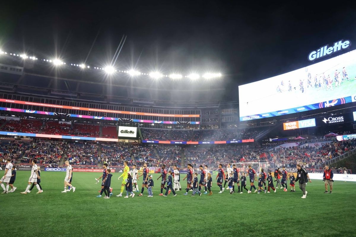 Oct 5, 2024; Foxborough, Massachusetts, USA; The New England Revolution and D.C. United walk onto the field before playing at Gillette Stadium. Mandatory Credit: Paul Rutherford-Imagn Images