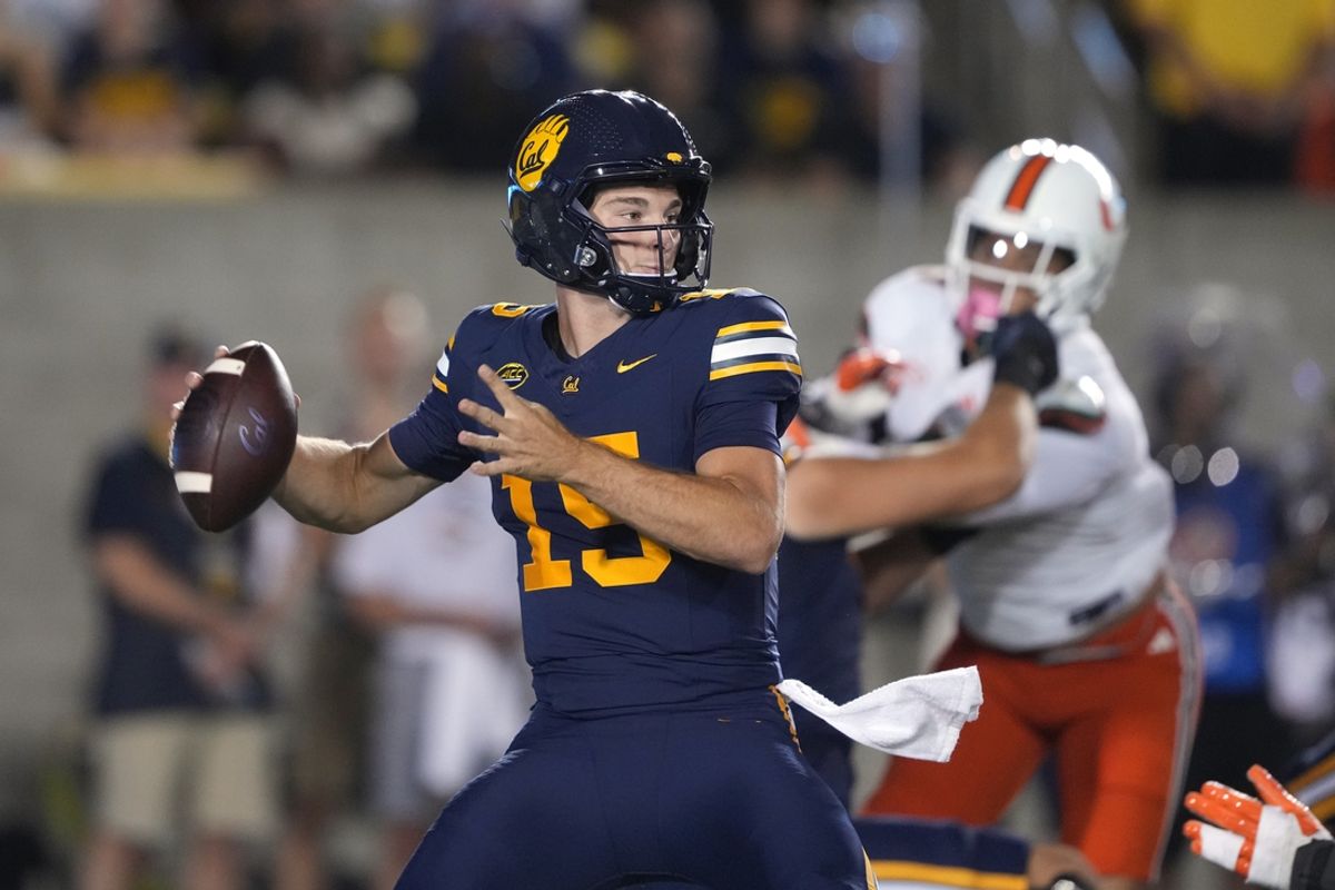 Oct 5, 2024; Berkeley, California, USA; California Golden Bears quarterback Fernando Mendoza (15) passes against the Miami Hurricanes during the first quarter at California Memorial Stadium. Mandatory Credit: Darren Yamashita-Imagn Images