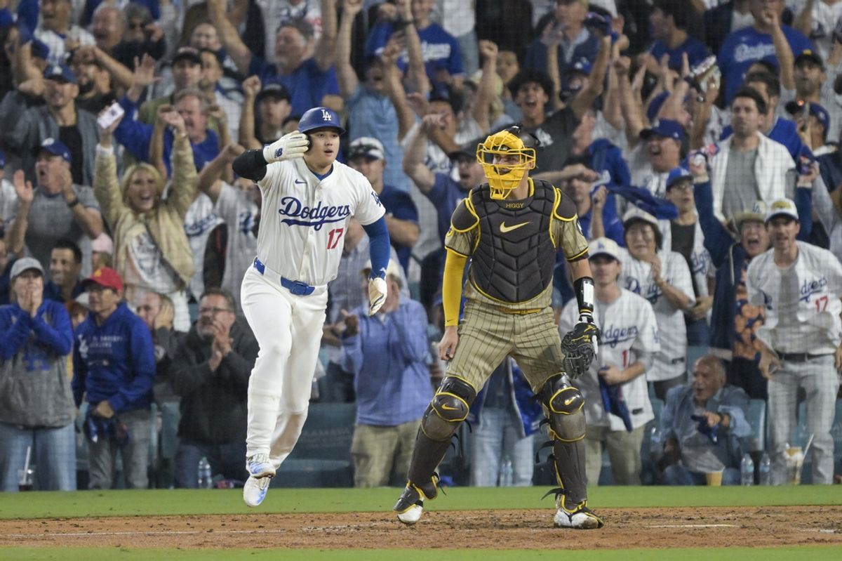 Oct 5, 2024; Los Angeles, California, USA; Los Angeles Dodgers designated hitter Shohei Ohtani (17) scores on a single by left fielder Teoscar Hernandez (37) (not pictured) against the San Diego Padres during game one of the NLDS for the 2024 MLB Playoffs at Dodger Stadium. Mandatory Credit: Jayne Kamin-Oncea-Imagn Images