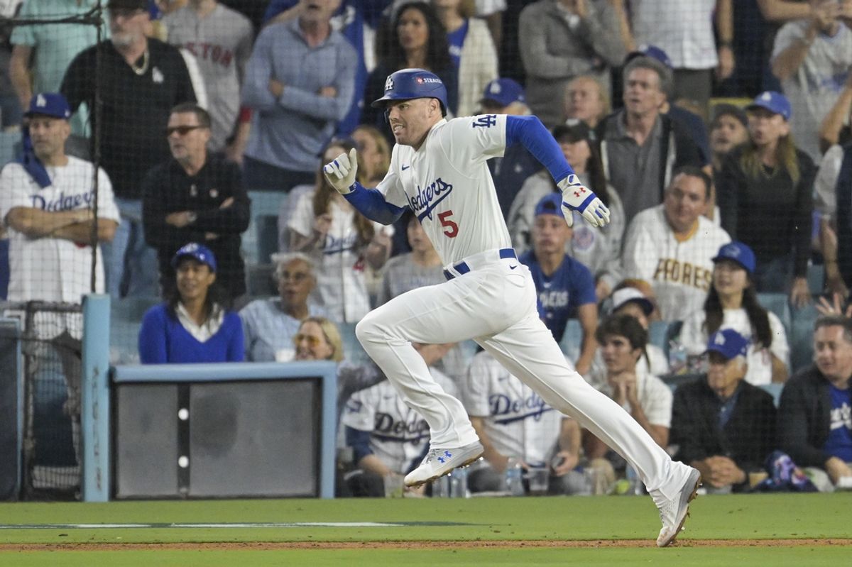 Oct 5, 2024; Los Angeles, California, USA; Los Angeles Dodgers first baseman Freddie Freeman (5) runs to first on a single in the fourth inning against the San Diego Padres during game one of the NLDS for the 2024 MLB Playoffs at Dodger Stadium. Mandatory Credit: Jayne Kamin-Oncea-Imagn Images