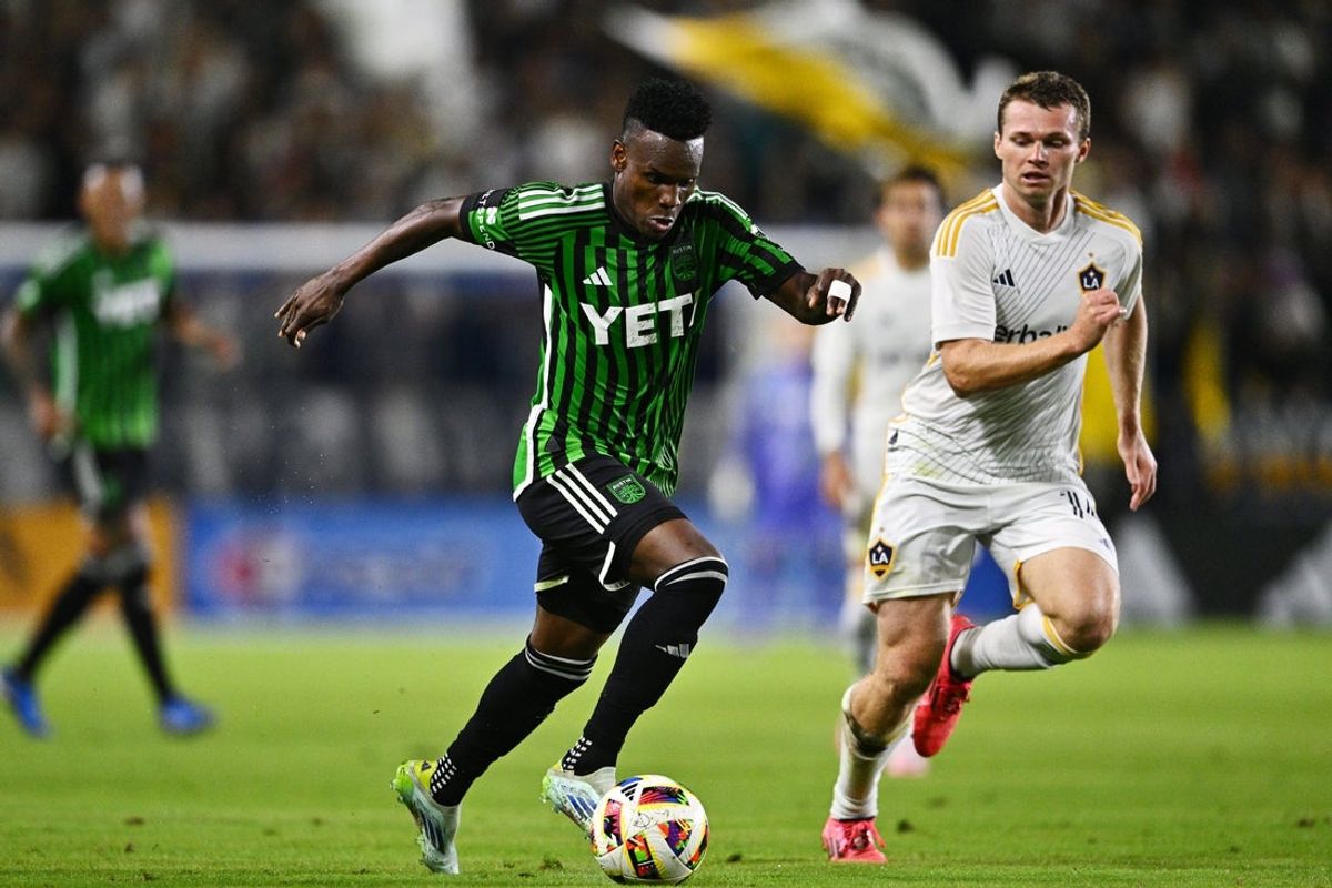 Oct 5, 2024; Carson, California, USA; Austin FC forward Jader Obrian (11) controls the ball against LA Galaxy defender John Nelson (14) in the first half at Dignity Health Sports Park. Mandatory Credit: Kelvin Kuo-Imagn Images
