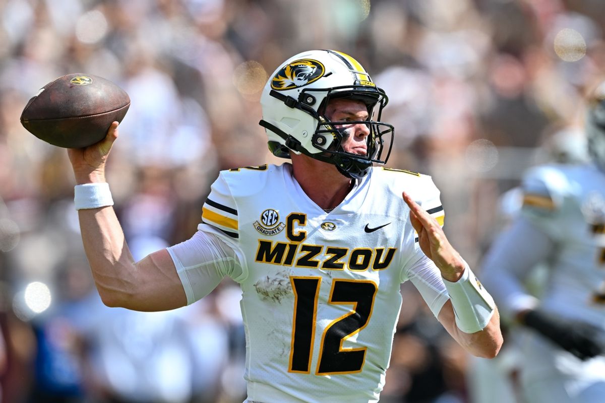 Oct 5, 2024; College Station, Texas, USA; Missouri Tigers quarterback Brady Cook (12) throws a pass in the first half against the Texas A&M Aggies at Kyle Field. Mandatory Credit: Maria Lysaker-Imagn Images.
