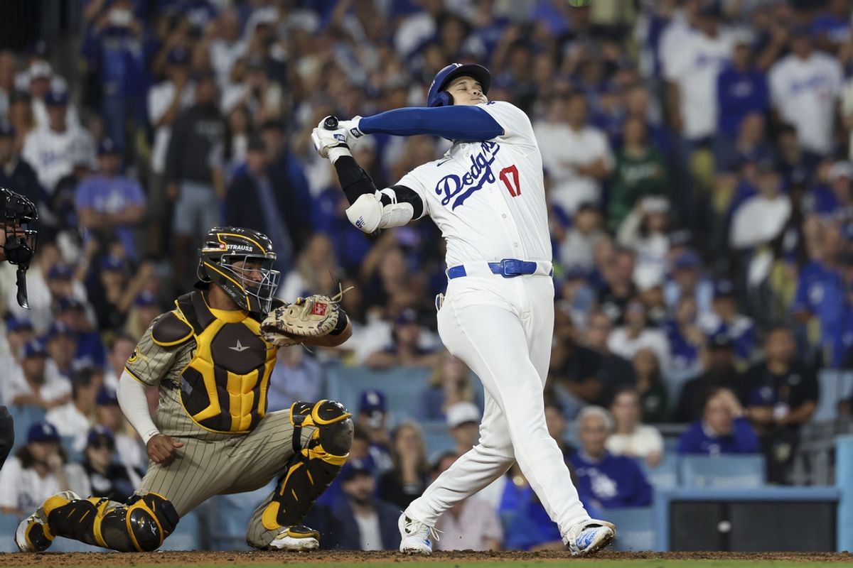 Oct 5, 2024; Los Angeles, California, USA; Los Angeles Dodgers designated hitter Shohei Ohtani (17) strikes out in the eighth inning against the San Diego Padres during game one of the NLDS for the 2024 MLB Playoffs at Dodger Stadium. Mandatory Credit: Kiyoshi Mio-Imagn Images