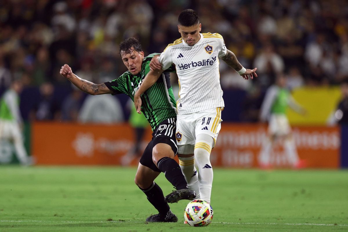 Oct 5, 2024; Carson, California, USA; Austin FC defender Guilherme Biro (29) and LA Galaxy forward Gabriel Pec (11) battle for the ball in the second half at Dignity Health Sports Park. Mandatory Credit: Ryan Sun-Imagn Images