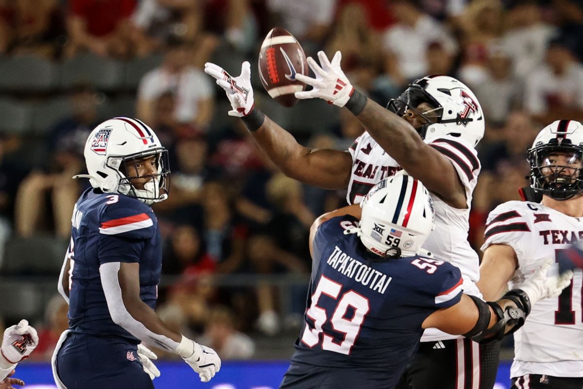 Oct 5, 2024; Tucson, Arizona, USA; Texas Tech defensive lineman Quincy Ledet Jr. (5) intercepts a pass from the Arizona Wildcats during second quarter. at Arizona Stadium. Mandatory Credit: Aryanna Frank-Imagn Images