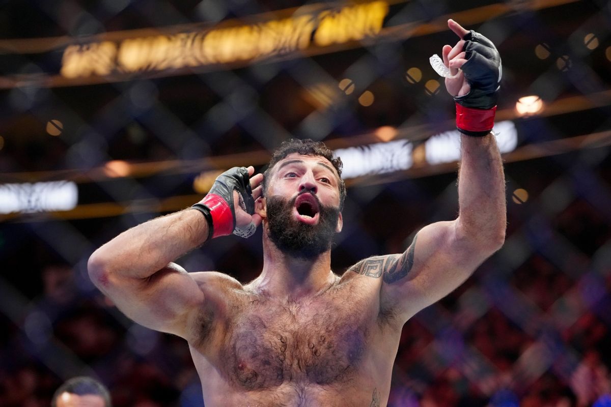 Oct 5, 2024; Salt Lake City, Utah, USA; Roman Dolidze (red gloves) reacts after defeating Kevin Holland (not pictured) during UFC 307 at Delta Center. Mandatory Credit: Stephen R. Sylvanie-Imagn Images