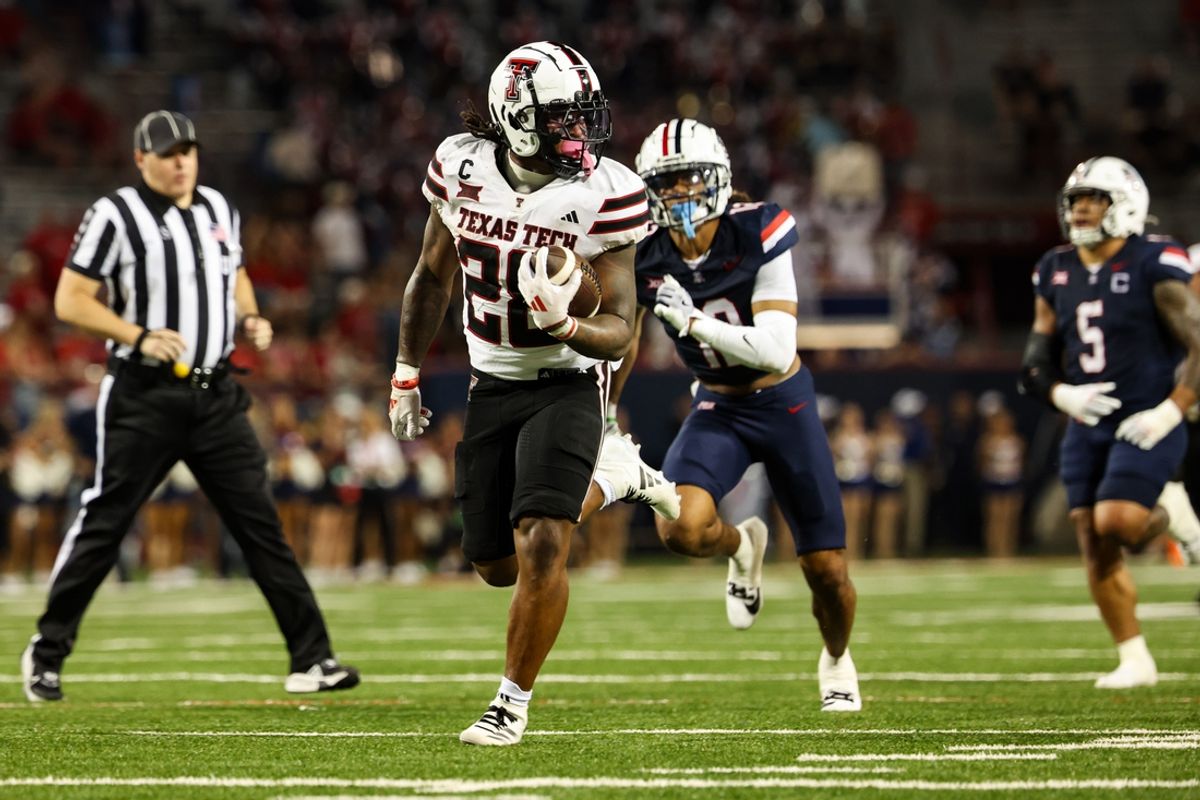 Oct 5, 2024; Tucson, Arizona, USA; Texas Tech Red Raiders running back Tahj Brooks (28) runs with ball while Arizona Wildcats defend during fourth quarter at Arizona Stadium. Mandatory Credit: Aryanna Frank-Imagn Images