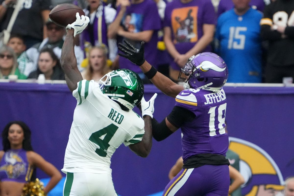 Oct 6, 2024; London, United Kingdom; New York Jets cornerback D.J. Reed (4) defends against Minnesota Vikings wide receiver Justin Jefferson (18) in the first half at Tottenham Hotspur Stadium. Mandatory Credit: Kirby Lee-Imagn Images