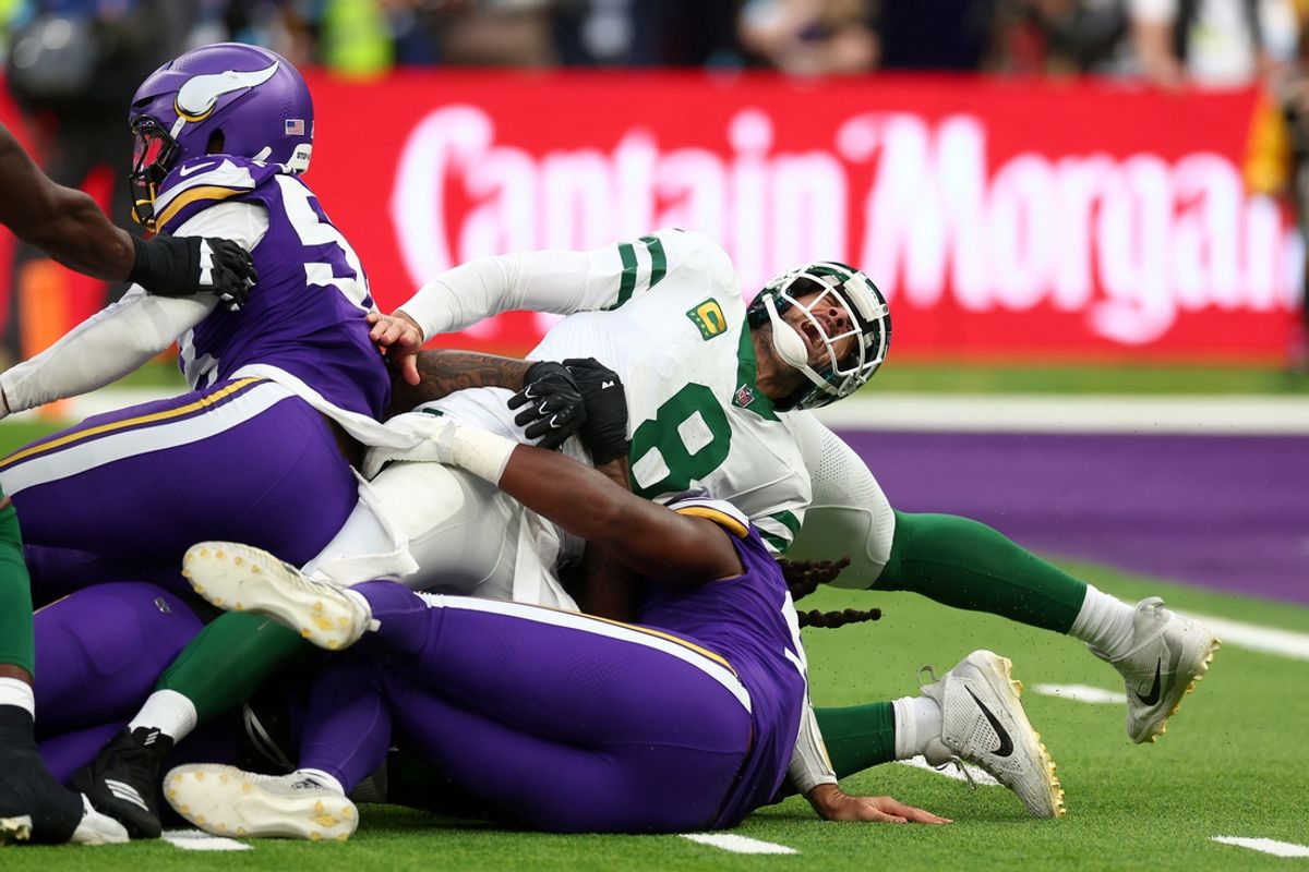 Oct 6, 2024; Tottenham, ENG; New York Jets quarterback Aaron Rodgers (8) suffers an injury after a tackle from Minnesota Vikings Linebacker Patrick Jones II (91) in the 3rd Quarter at Tottenham Hotspur Stadium. Mandatory Credit: Shaun Brooks-Imagn Images