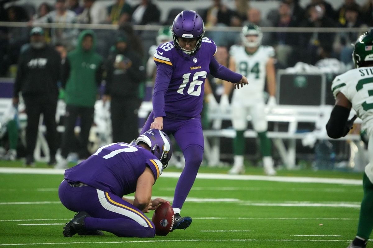 Oct 6, 2024; London, United Kingdom; Minnesota Vikings place kicker Will Reichard (16) kicks a 41-yard field goal out of the hold of punter Ryan Wright (17) in the fourth quarter against the New York Jets at Tottenham Hotspur Stadium. Mandatory Credit: Kirby Lee-Imagn Images