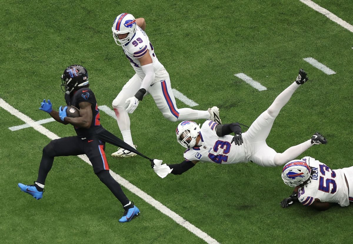 Oct 6, 2024; Houston, Texas, USA; Buffalo Bills linebacker Terrel Bernard (43) grabs Houston Texans running back Cam Akers (22) jersey in the first quarter at NRG Stadium. Mandatory Credit: Thomas Shea-Imagn Images