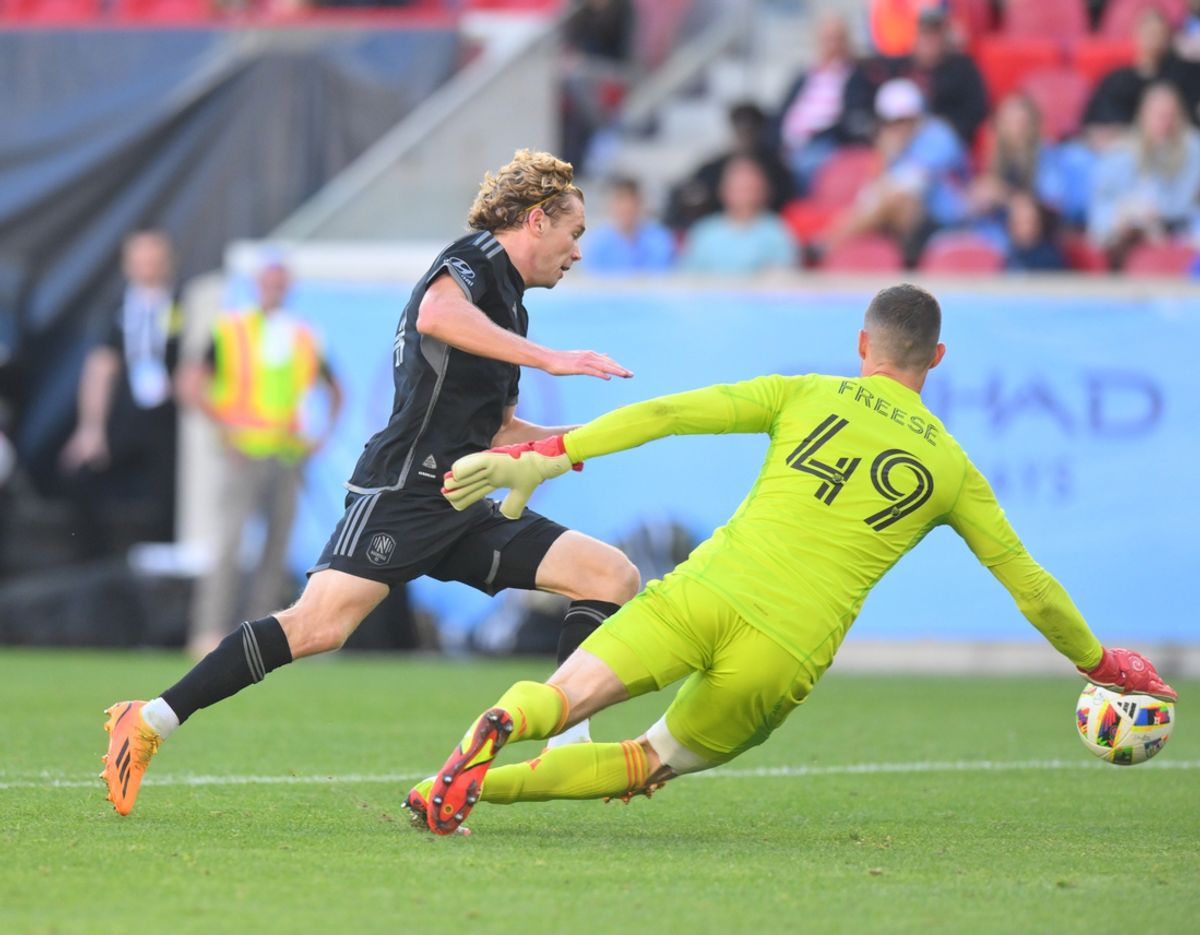 Oct 6, 2024; Harrison, New Jersey, USA; Nashville SC forward Jacob Shaffelburg (14) attempts a shot on goal past New York City FC goalkeeper Matt Freese (49) during the first half at Red Bull Arena. Mandatory Credit: John Jones-Imagn Images