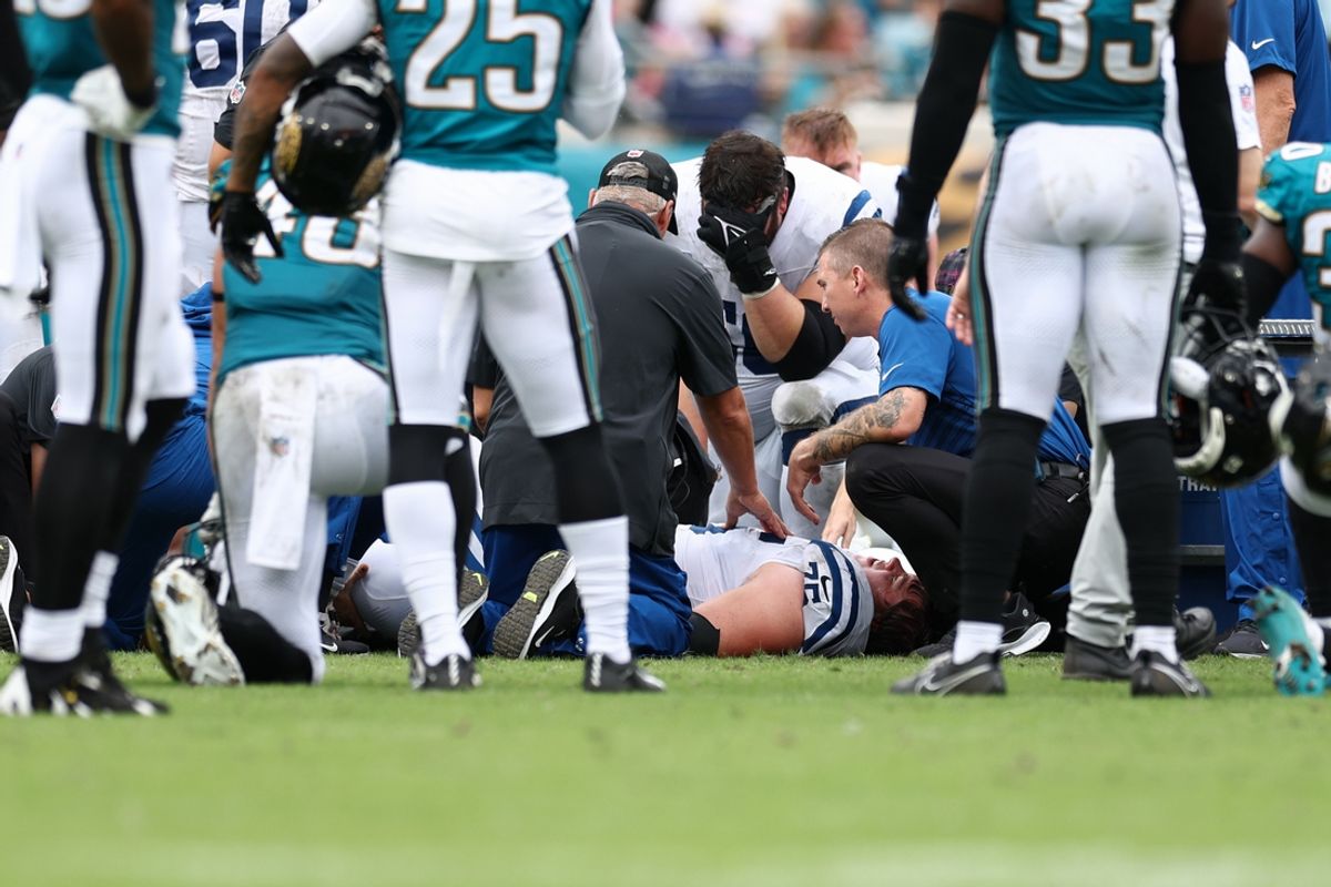 Oct 6, 2024; Jacksonville, Florida, USA; Indianapolis Colts guard Will Fries (75) is attended to by medical staff against the Jacksonville Jaguars in the third quarter at EverBank Stadium. Mandatory Credit: Nathan Ray Seebeck-Imagn Images