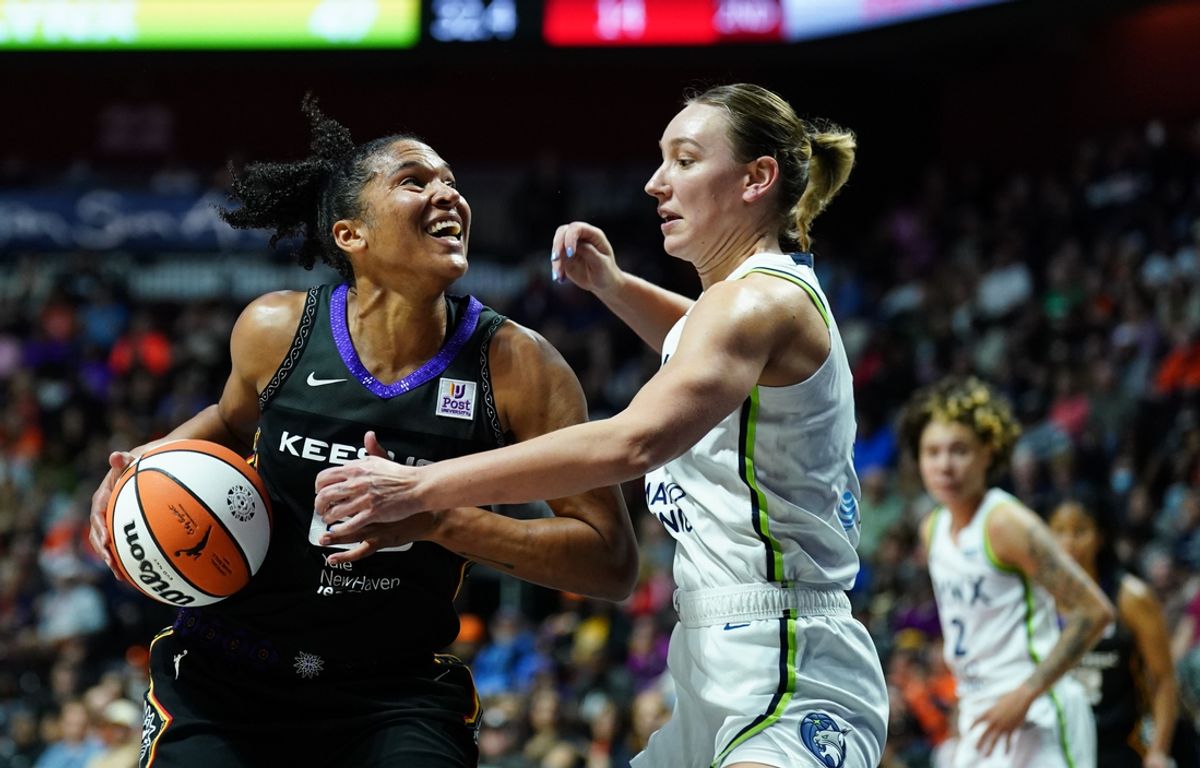 Oct 6, 2024; Uncasville, Connecticut, USA; Connecticut Sun forward Alyssa Thomas (25) drives the ball against Minnesota Lynx forward Alanna Smith (8) in the second quarter during game four of the 2024 WNBA Semi-finals at Mohegan Sun Arena. Mandatory Credit: David Butler II-Imagn Images