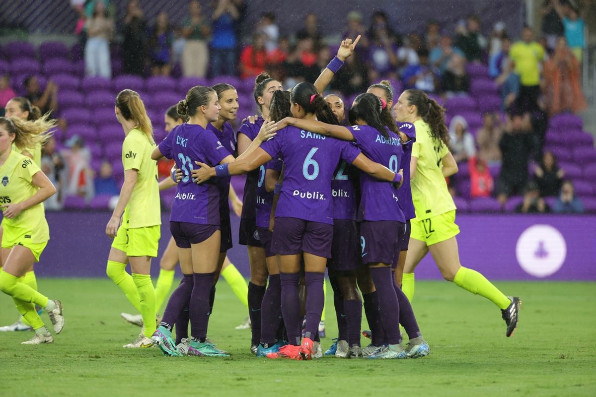 Oct 6, 2024; Orlando, Florida, USA; Orlando Pride forward Marta (10) is mobbed by teammates after scoring in the second half against the Washington Spirit at Inter&Co Stadium. Mandatory Credit: Mike Watters-Imagn Images