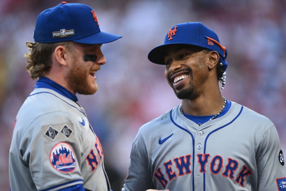 Oct 6, 2024; Philadelphia, Pennsylvania, USA; New York Mets shortstop Francisco Lindor (12) reacts with outfielder Harrison Bader (44) after the in the fifth inning against the Philadelphia Phillies during game two of the NLDS for the 2024 MLB Playoffs at Citizens Bank Park. Mandatory Credit: Kyle Ross-Imagn Images