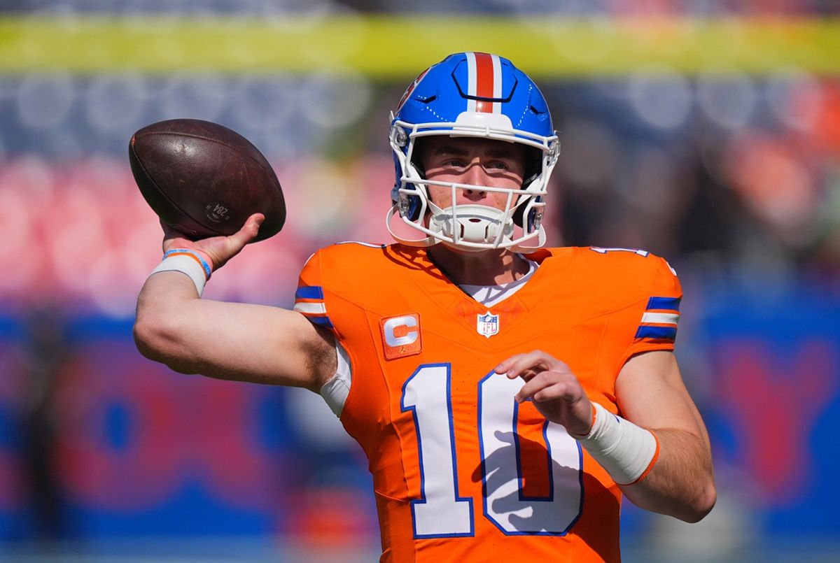 Oct 6, 2024; Denver, Colorado, USA; Denver Broncos quarterback Bo Nix (10) warms up before the game against the Las Vegas Raiders at Empower Field at Mile High. Mandatory Credit: Ron Chenoy-Imagn Images