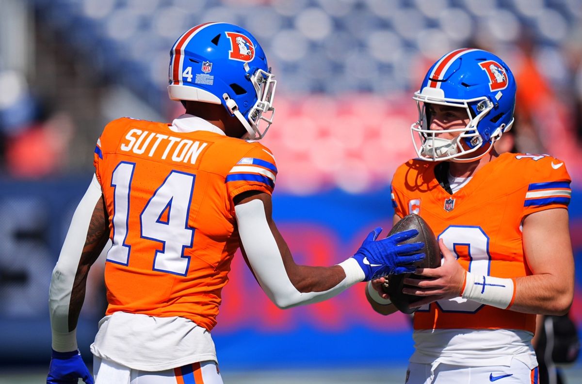 Oct 6, 2024; Denver, Colorado, USA; Denver Broncos wide receiver Courtland Sutton (14) and quarterback Bo Nix (10) before the game against the Las Vegas Raiders at Empower Field at Mile High. Mandatory Credit: Ron Chenoy-Imagn Images